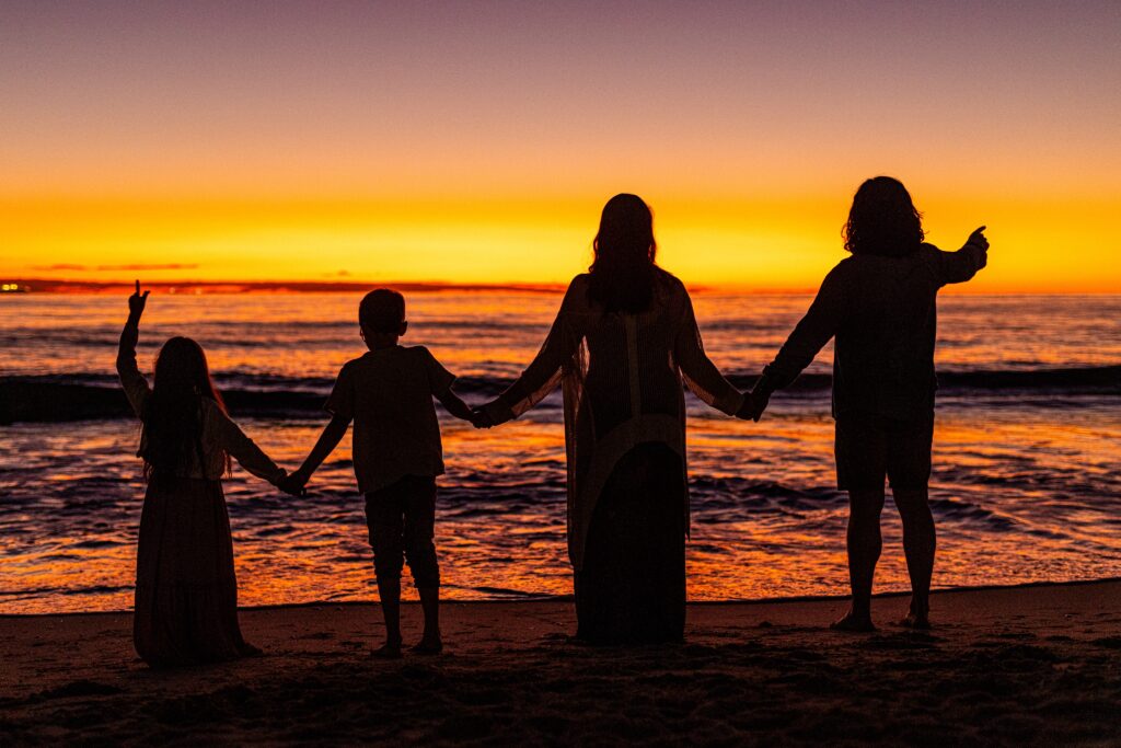 Andrew and Lara Pilcher and kids at sunset by Scot Davies Photography.